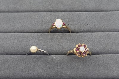 Lot 74 - TWO OPAL AND GARNET CLUSTER RINGS, together...