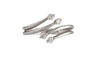 Lot 91 - A DIAMOND RING, of cross over design, mounted...