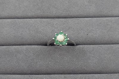 Lot 92 - AN OPAL AND EMERALD CLUSTER RING, the round...
