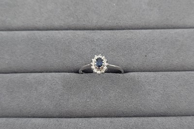 Lot 98 - A SAPPHIRE AND DIAMOND CLUSTER RING, the...