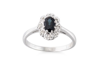 Lot 101 - A SAPPHIRE AND DIAMOND CLUSTER RING, the...