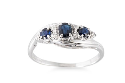 Lot 102 - A SAPPHIRE AND DIAMOND SET BAND RING, of cross...