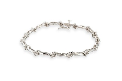 Lot 220 - A DIAMOND SET BRACELET, comprising a series of...