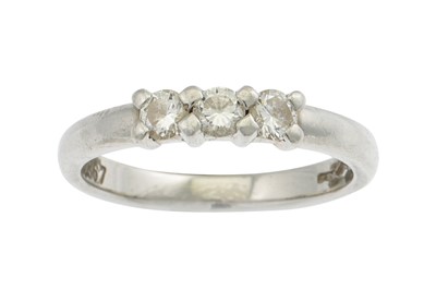 Lot 96 - A DIAMOND THREE STONE RING, the round...