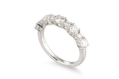 Lot 284 - A DIAMOND BAND RING, set with brilliant cut...