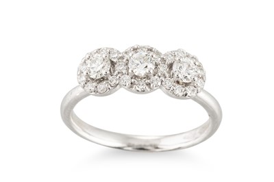 Lot 286 - A DIAMOND TRIPLE CLUSTER RING, the brilliant...