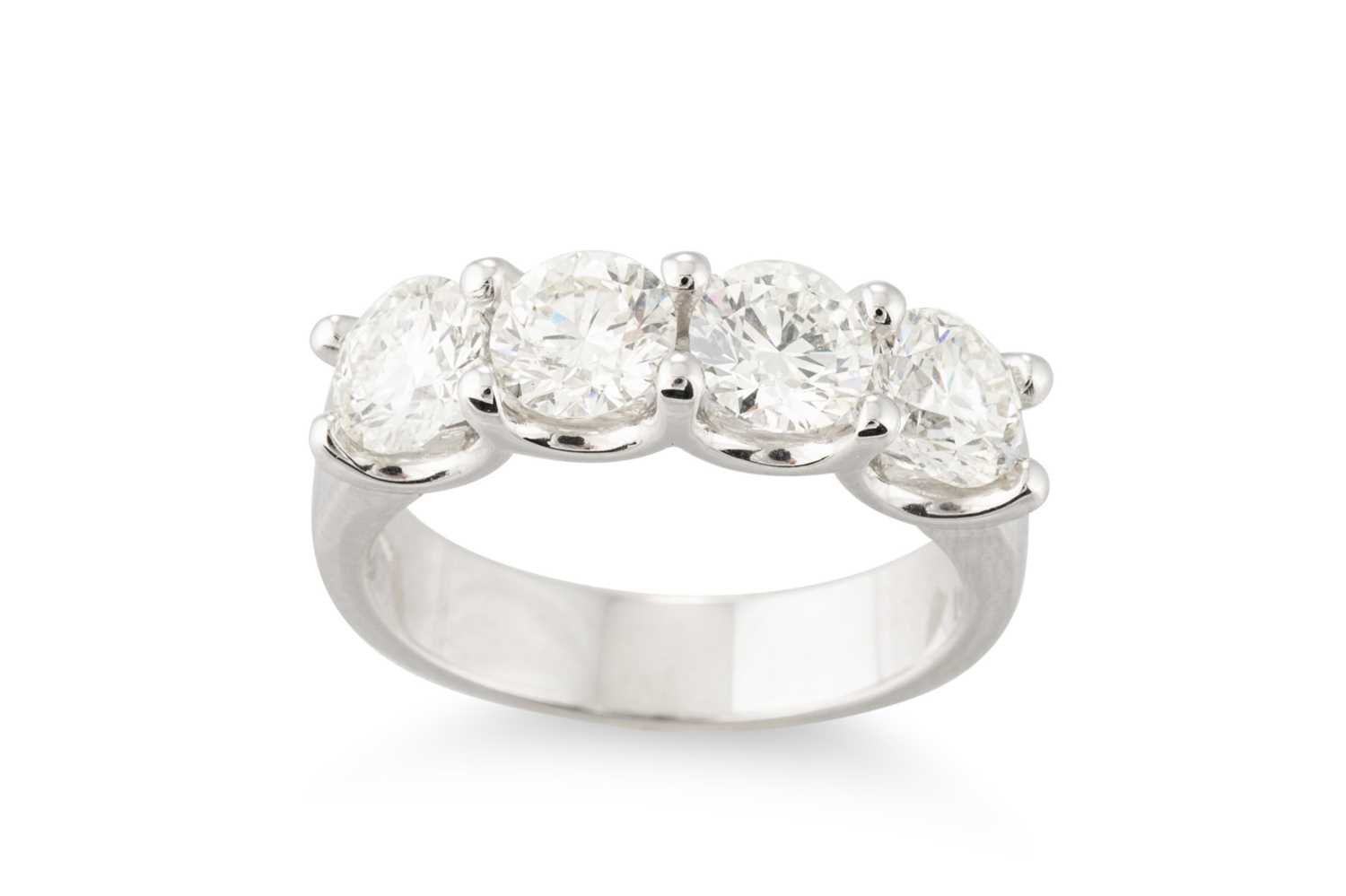 Lot 288 - A FOUR STONE DIAMOND RING, the brilliant cut...
