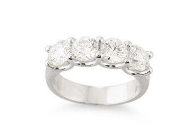 Lot 288 - A FOUR STONE DIAMOND RING, the brilliant cut...