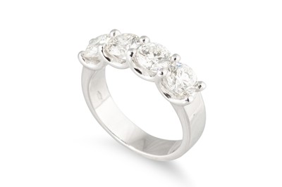 Lot 288 - A FOUR STONE DIAMOND RING, the brilliant cut...
