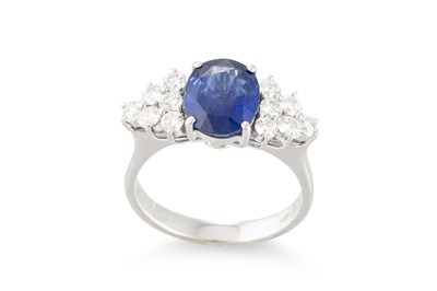 Lot 290 - A SAPPHIRE AND DIAMOND RING, the oval sapphire...
