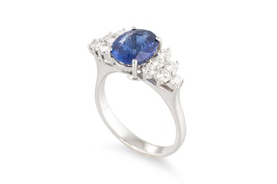 Lot 290 - A SAPPHIRE AND DIAMOND RING, the oval sapphire...