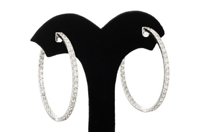 Lot 291 - A PAIR OF DIAMOND HOOP EARRINGS, the diamonds...