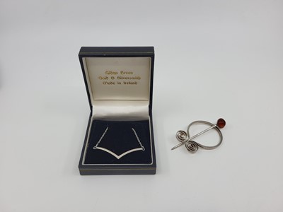 Lot 507 - A MODERN IRISH SILVER CLOAK BROOCH, inset with...