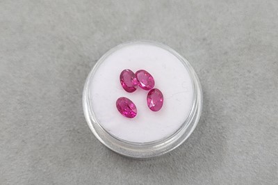 Lot 110 - FOUR LOOSE OVAL CUT RUBIES, the oval cut...
