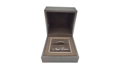 Lot 320 - A DIAMOND SET BAND RING, the wave pattern ring...