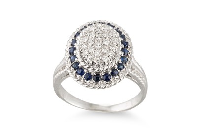 Lot 186 - A PAVÉ DIAMOND AND SAPPHIRE CLUSTER RING,...