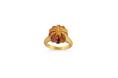Lot 71 - A CITRINE RING, the carved citrine mounted in...