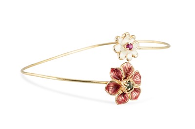 Lot 232 - A GEMSTONE & EMERALD SET BANGLE, of openwork...