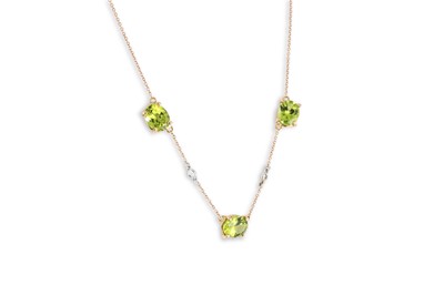 Lot 233 - A PERIDOT AND DIAMOND SET NECKLACE, the trio...