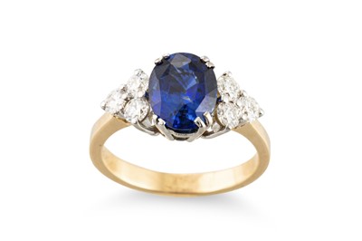 Lot 265 - A SAPPHIRE AND DIAMOND RING, the oval sapphire...