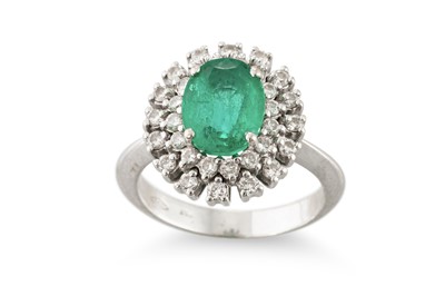 Lot 331 - AN EMERALD AND DIAMOND CLUSTER RING, the oval...
