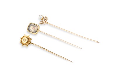 Lot 26 - THREE MOSTLY GOLD ANTIQUE STICK PINS, one...