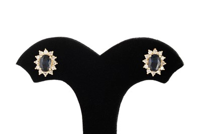 Lot 85 - A PAIR OF DIAMOND AND SAPPHIRE CLUSTER...