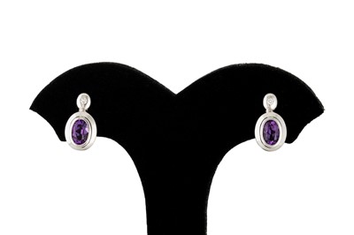 Lot 102 - A PAIR OF AMETHYST EARRINGS, bezel set, the...
