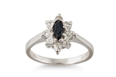 Lot 112 - A DIAMOND AND SAPPHIRE CLUSTER RING, the...
