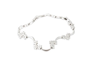 Lot 138 - A DIAMOND SET BRACELET, the brilliant cut...