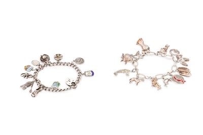 Lot 1 - TWO VINTAGE SILVER CHARM BRACELETS, various...