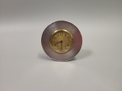 Lot 551 - A SILVER ART DECO SMALL CIRCULAR CLOCK,...