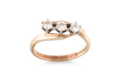Lot 235 - A DIAMOND THREE-STONE RING, the round...