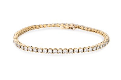 Lot 380 - A DIAMOND LINE BRACELET, the brilliant cut...