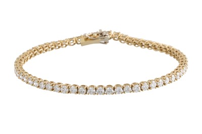 Lot 228 - A DIAMOND LINE BRACELET, the brilliant cut...