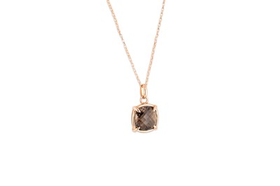 Lot 4 - A SMOKY QUARTZ SET PENDANT, mounted in 9ct gold