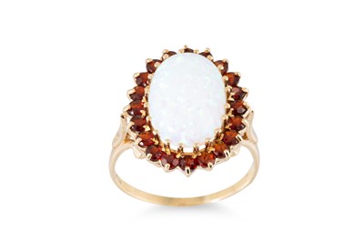 Lot 28 - A SYNTHETIC OPAL AND GARNET SET CLUSTER RING,...