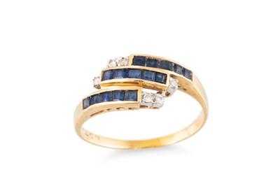 Lot 64 - A SAPPHIRE AND DIAMOND CROSS OVER RING, the...