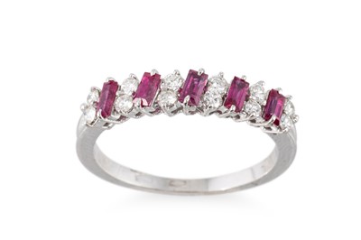 Lot 176 - A RUBY AND DIAMOND SET BAND RING, set with...