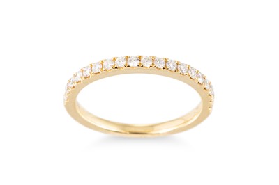 Lot 178 - A DIAMOND SET HALF ETERNITY RING, mounted in...