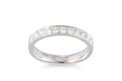 Lot 179 - A DIAMOND SET HALF ETERNITY RING, mounted in...