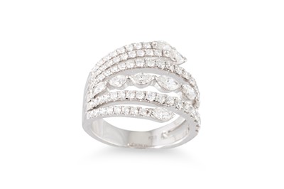 Lot 313 - A DIAMOND SET BAND RING, cross-over split...