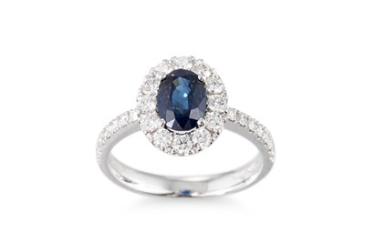 Lot 317 - A SAPPHIRE AND DIAMOND SET CLUSTER RING, the...