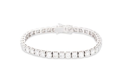 Lot 325 - A DIAMOND SET LINE BRACELET, the brilliant cut...