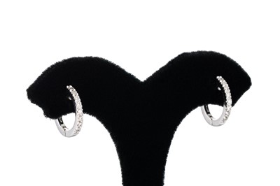 Lot 357 - A PAIR OF DIAMOND SET HOOP EARRINGS, mounted...