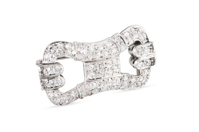 Lot 387 - AN ART DECO DIAMOND SET BROOCH, of stylised...