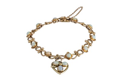 Lot 133 - AN OPAL BRACELET, the cabochon opals mounted...