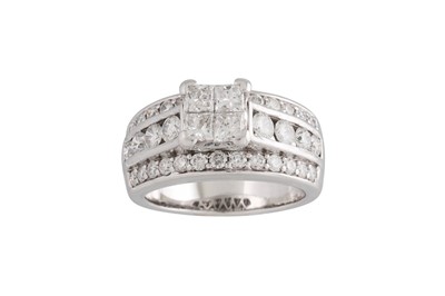 Lot 137 - A DIAMOND CLUSTER RING, four princess cut...