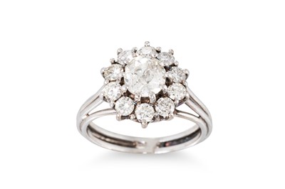 Lot 343 - A VINTAGE DIAMOND CLUSTER RING, mounted in...