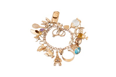 Lot 128 - A 9CT YELLOW GOLD CHARM BRACELET, with various...